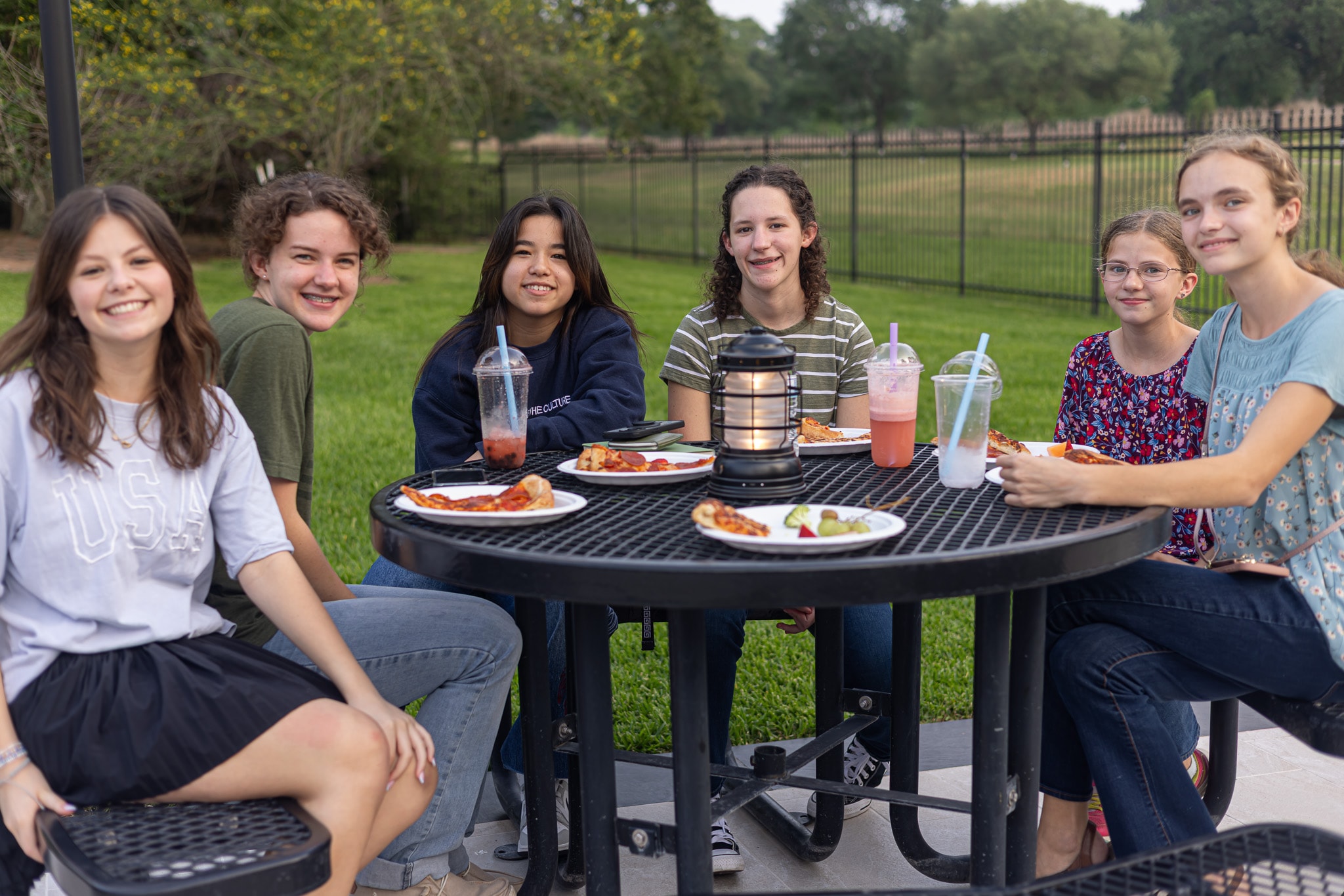 YAF Houston students enjoying food and drinks outdoors