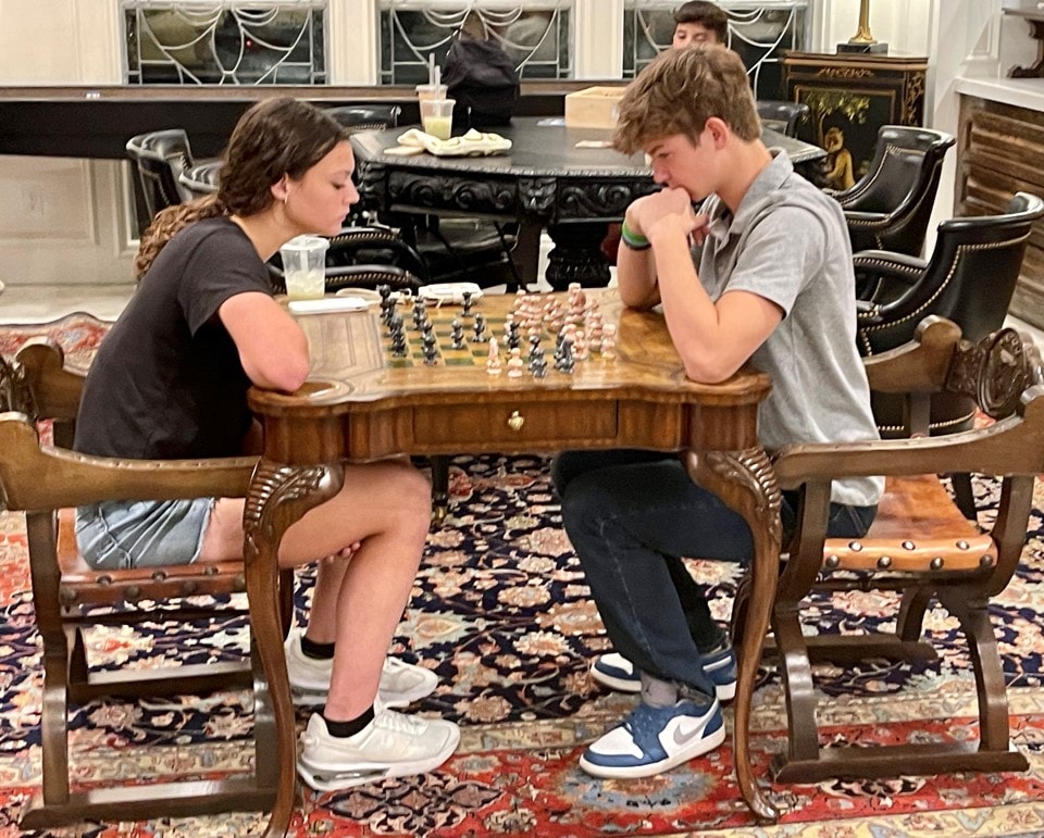 YAF Houston students playing chess at the estate