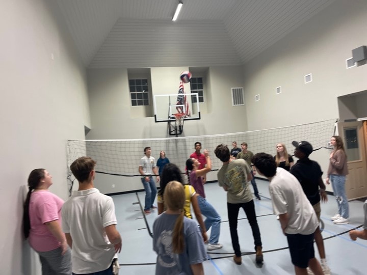 YAF Houston students playing volleyball indoors
