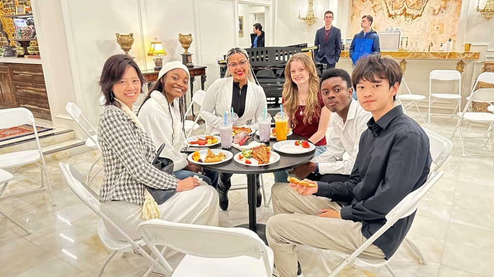 YAF Houston students dining together at an elegant venue