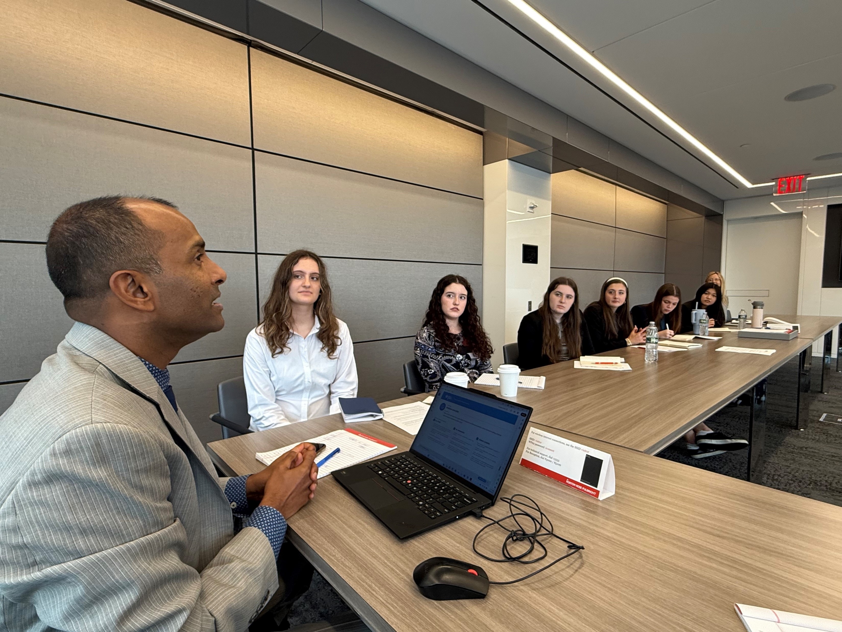 YAF Houston students in a conference room meeting with a professional speaker