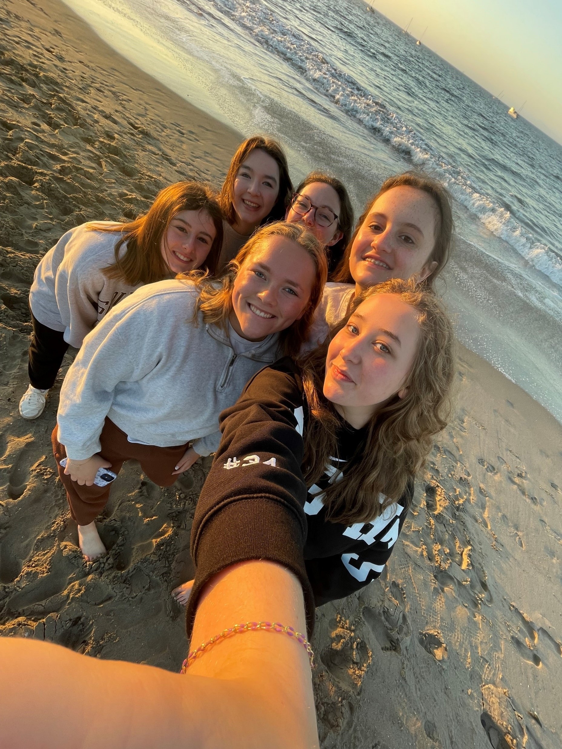 YAF Houston students taking a beach selfie at sunset in Santa Barbara